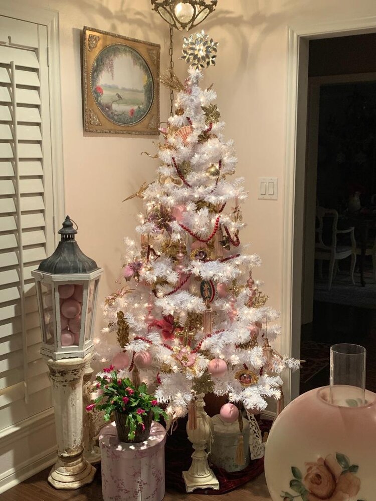 vintage and antique white Christmas tree and red pink gold ornaments and decorations